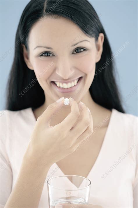 Woman Taking A Pill Stock Image F001 1382 Science Photo Library