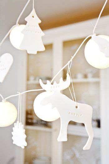 The Lights Are Hanging From The Ceiling In The Living Room Or Dining Room With Deer And