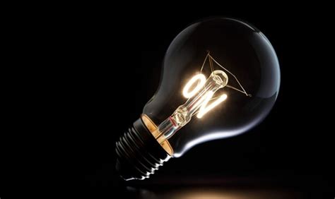 Premium Ai Image Open Light Bulb On A Black Background