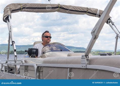 Mature Men Driving A Pontoon Boat On A Lake Stock Image Image Of Lake