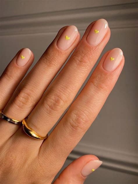 Tiny Yellow Heart On Nude Nails Casual Nails Chic Nails Stylish Nails