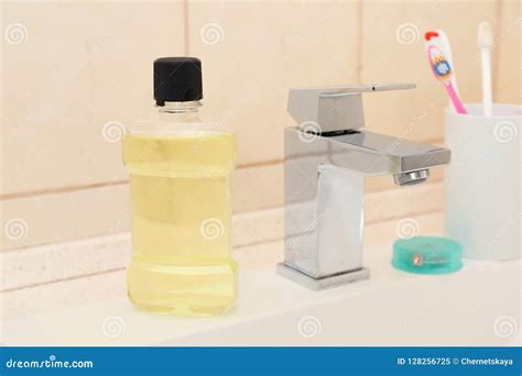 Mouthwash And Holder With Toothbrushes On Sink Stock Image Image Of