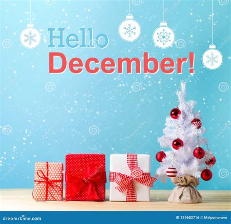 Hello December Message with a Christmas Tree and Gift Boxes Stock Photo ...