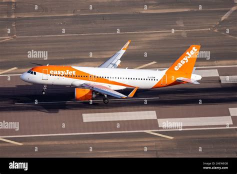 Easyjet Airplane Landing To The Airport During Sunny Morning Aerial