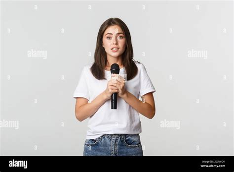 Shy Cute Brunette Girl Scared Of Singing In Public Standing With