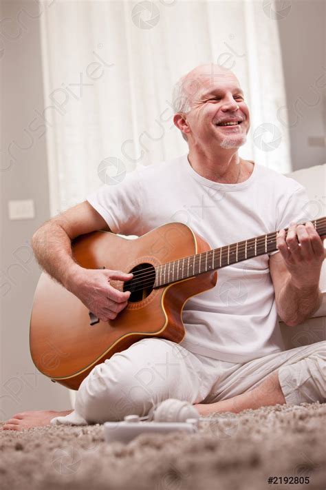Mature Man Playing Guitar At Home Stock Photo 2192805 Crushpixel