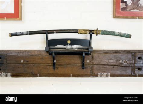 Japanese single edged sword - katana in a kake kept in its scabbard (or ...