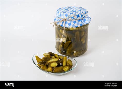 Top View Of Cucumber Pickles Jar And Sliced Pickled Gherkins On Glass