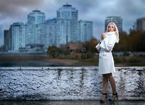 Girl walking in the rain stock photo. Image of blond - 27549782