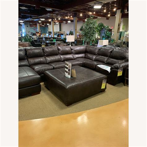 Mealey S Brown Leather Sectional And Ottoman Aptdeco