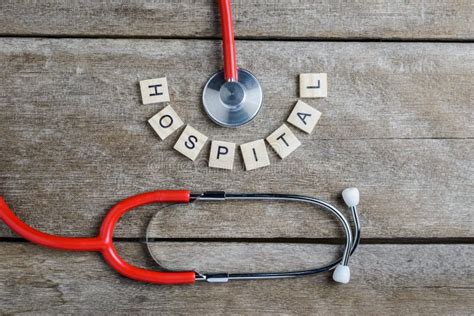 Healthcare Text Word Made With Wood Blocks And Red Heartstethoscope On