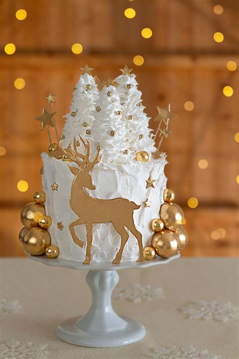 A White And Gold Christmas Cake On A Table