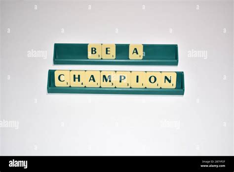 Scrabble Tiles Spell Out Be A Champion Motivational Quote Scrabble