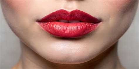 Premium Photo Red Lipstick Adorns Womans Lips