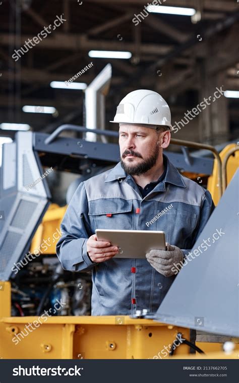 Serious Mature Male Worker Quality Control Stock Photo