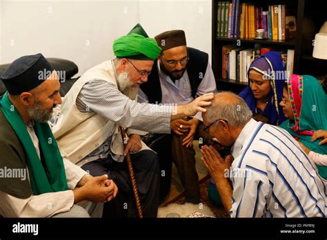 Sufi Muslim Receiving A Blessing From Mawlana Sheikh Mehmet Efendi In