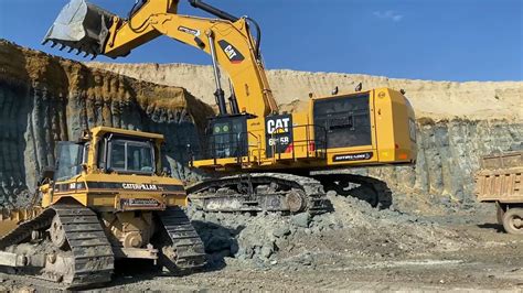 Caterpillar 6015b Excavator Loading Trucks With Two Passes Sotiriadis