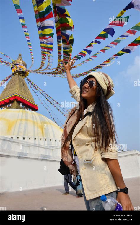 Traveler Thai Women In Boudhanath Or Bodnath Stupa With Buddha Eyes Or