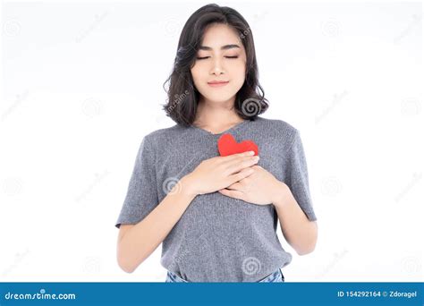 Portrait Of Beautiful Asian Woman With Appealing Smile And Holding