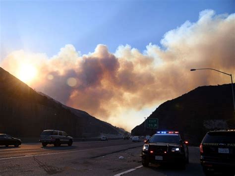 Dramatic Images Of LA Fire Looming Over The 405 Freeway During Morning