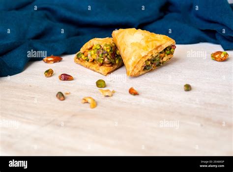 Arabic sweets named baklava filled with pistachio Stock Photo - Alamy