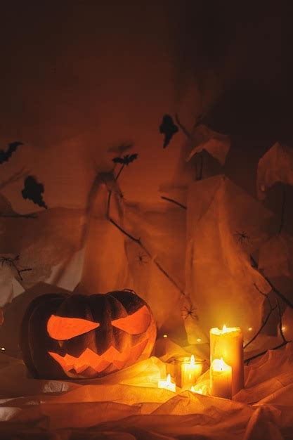 Premium Photo Happy Halloween Jack O Lantern Carved Pumpkin Spider Web Ghost Bats And Glowing