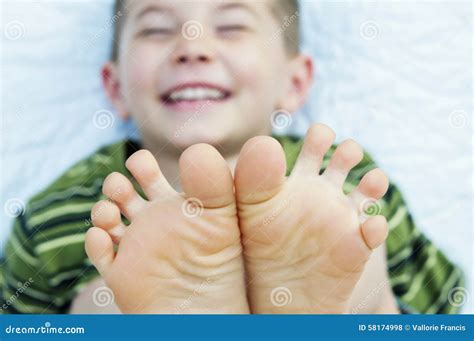 Boy Laughing Barefoot Toes Stock Photo - Image: 58174998