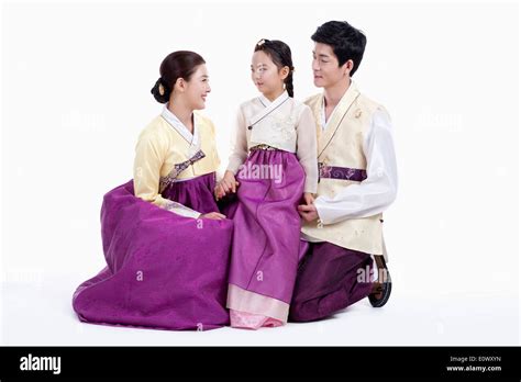 a family wearing traditional Korean outfits Stock Photo - Alamy