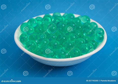 Bowl Of Popping Boba Pearls On A Bright Blue Background Stock Image