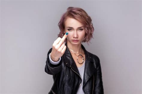 Premium Photo Serious Rude Woman Standing Showing Middle Finger