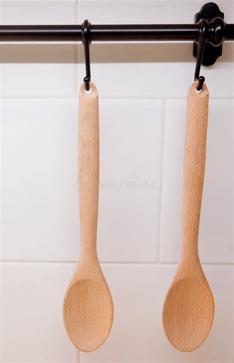 Two Wooden Spoons Hanging On The Wall Stock Image Image Of Serve