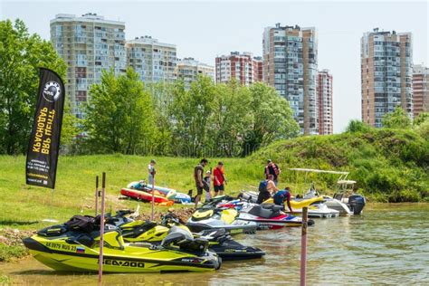 Brp Sea Doo Jet Ski Watercrafts Rest By Lake Bank On Sunny Day On City