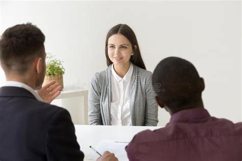 Confident Applicant Smiling At Job Interview With Diverse Hr Man Stock