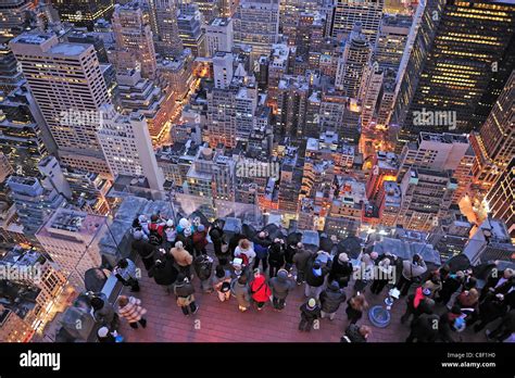 People Standing Viewing Deck City Lights Dusk Top Of The Rock