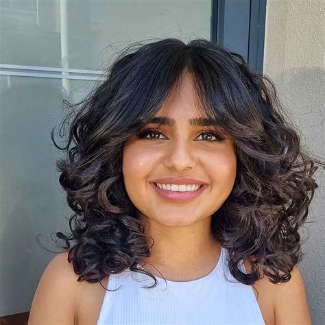 Best Ways To Get Curtain Bangs For Curly Hair Right Now