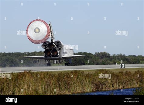 Space Shuttle Atlantis Unfurls Its Drag Chute Upon Landing At Kennedy