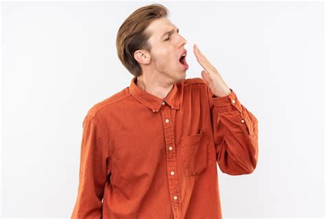 Free Photo Yawning Young Handsome Guy Wearing Red Shirt Covered Mouth