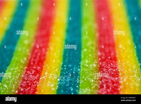 Background Of Rainbow Sour Jelly Candies Strips In Sugar Sprinkle Top