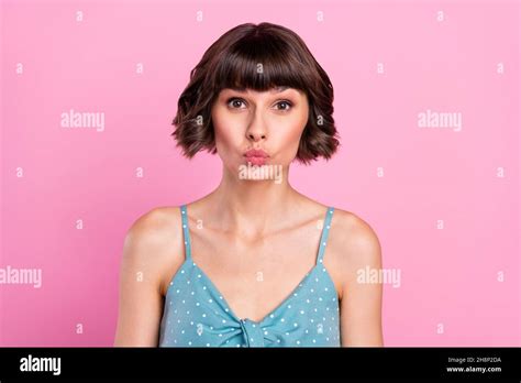 Portrait Of Attractive Amorous Brown Haired Girl Sending Air Kiss