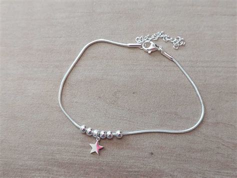 PULSERA DE ACERO BLANCO COLA DE RATÓN CON BOLITAS Y DIJE ESTRELLA