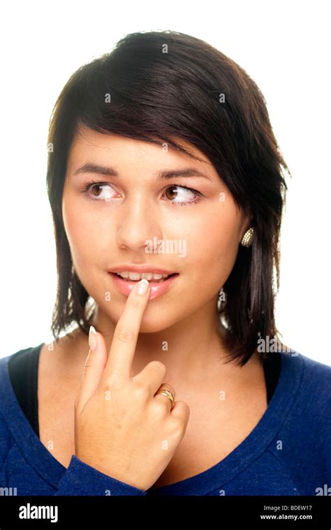 Girl Thinking With Finger On Lip Stock Photo Alamy