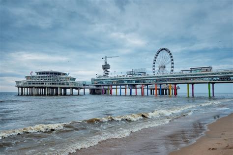 Premium Photo | The scheveningen pier strandweg beach in the hague with ...