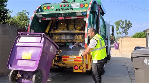 WM Freightliner McNeilus Rear Loader Garbage Truck Munching On Alley