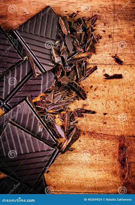 Chopped Chocolate Bar On Wooden Background Closeup Broken Dark Stock