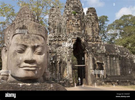 Sculpture Of Head Beside Road To Gate Tower Of Khmer Temple South Gate