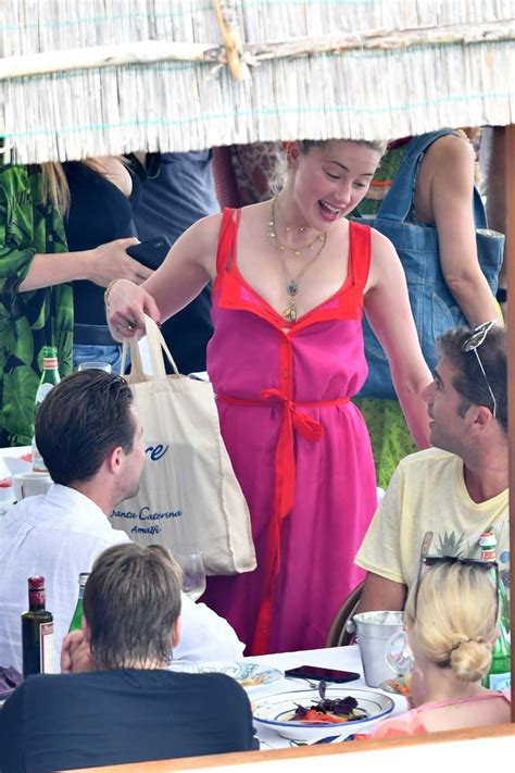 Amber Heard Dons A Red Bikini As She Enjoys A Day With Friends Aboard A