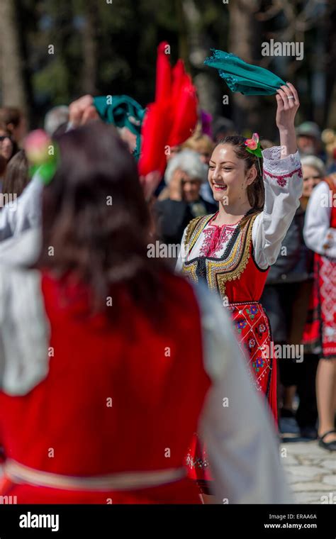 A Joyful Female Bulgarian Folklore Dancer During The Traditional