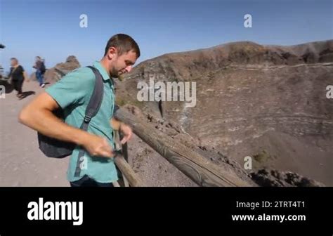 Excited Man Coming To Observation Deck Edge On Vesuvius Top Take Video