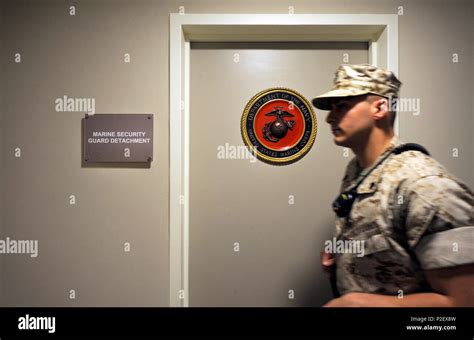 U S Marine Sgt Jon Montoto A Marine Security Guard Patrols A