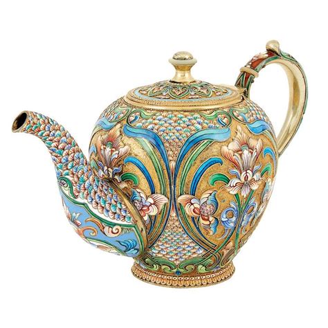 An Ornately Decorated Teapot With Gold Trimming